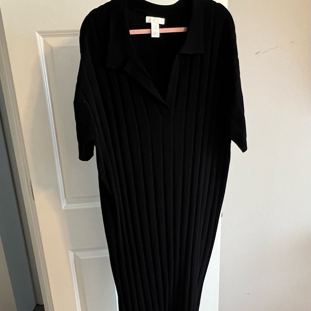 Black ribbed dress below the knee.
